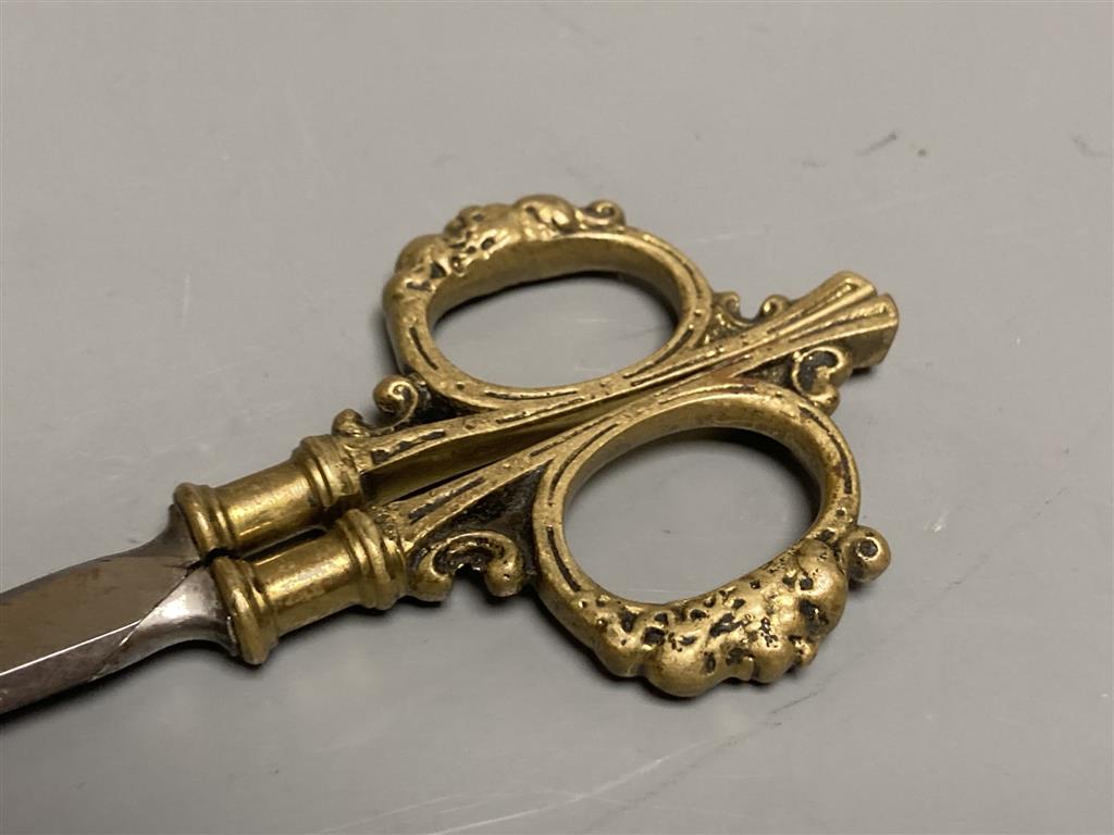 A pair of 18th/19th century Ottoman brass and steel calligraphers scissors with engraved decoration and three other pairs of scissors